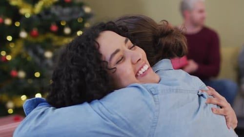 A big warm hug by the tree.