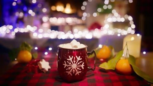 A cup of cocoa by the fireplace.