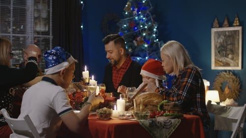 A big family dinner, candles lit.