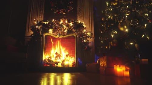 Dark cozy room, fireplace and twinkling tree lights.