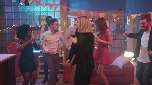 The full room dancing, wide.