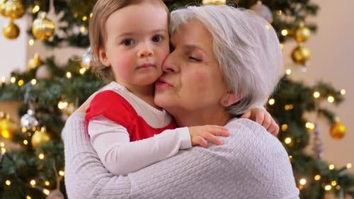 Grandmother hugs her granddaughter.